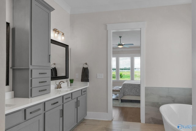 241 Farmhouse Dr, Madison, AL 35757 - full bath featuring a ceiling fan, double vanity, ensuite bathroom, a freestanding bath, and wood finished floors