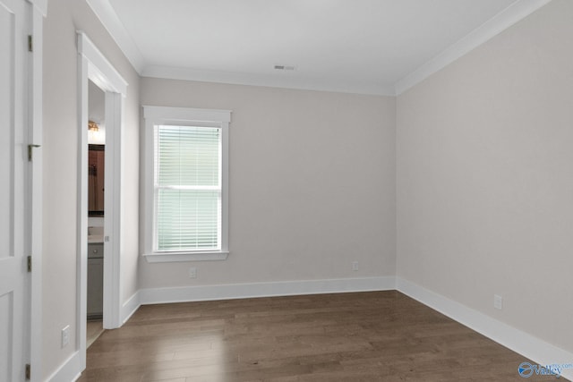 241 Farmhouse Dr, Madison, AL 35757 - empty room with crown molding, dark wood finished floors, and baseboards