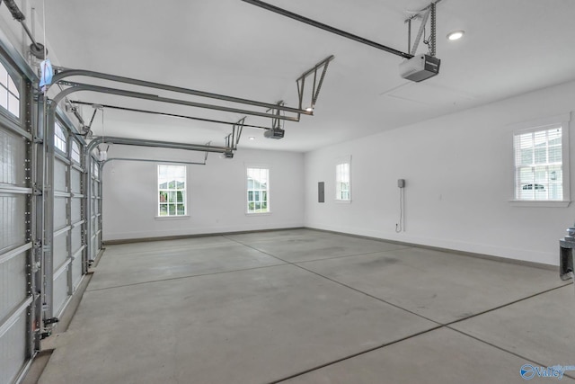 241 Farmhouse Dr, Madison, AL 35757 - garage featuring a garage door opener and baseboards