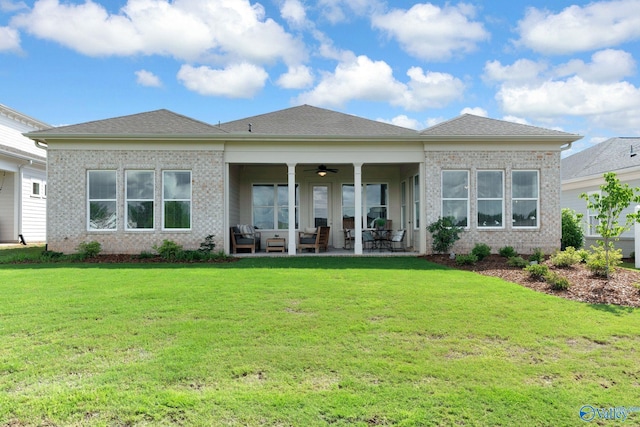 241 Farmhouse Dr, Madison, AL 35757 - rear view of property featuring an outdoor hangout area, a ceiling fan, a lawn, and brick siding