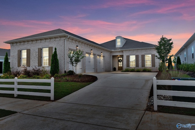 241 Farmhouse Dr, Madison, AL 35757 - view of front of house with concrete driveway, brick siding, and an attached garage