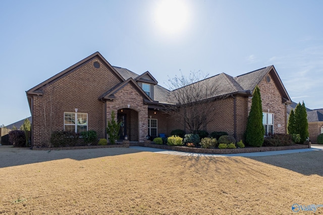 108 NW Rockhaven Dr, Madison, AL 35757 - view of front facade with brick siding and a front lawn