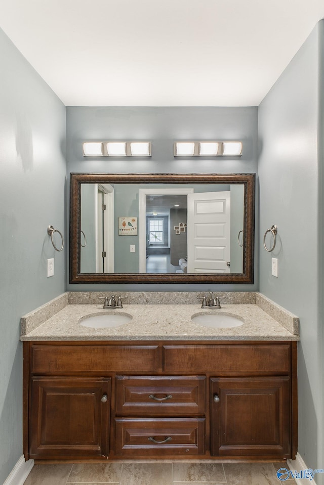 108 NW Rockhaven Dr, Madison, AL 35757 - bathroom featuring double vanity and baseboards