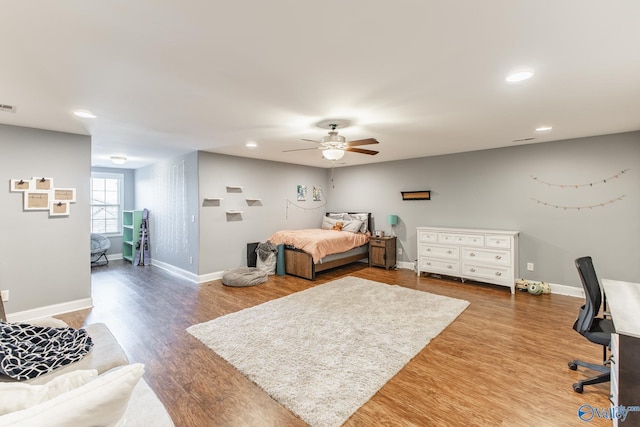108 NW Rockhaven Dr, Madison, AL 35757 - bedroom with wood finished floors, baseboards, ceiling fan, recessed lighting, and a desk