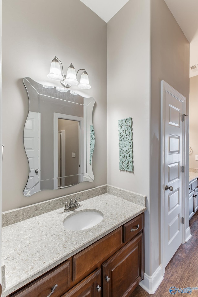 108 NW Rockhaven Dr, Madison, AL 35757 - bathroom with vanity and wood finished floors