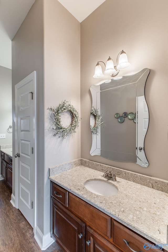 108 NW Rockhaven Dr, Madison, AL 35757 - bathroom with vanity and wood finished floors