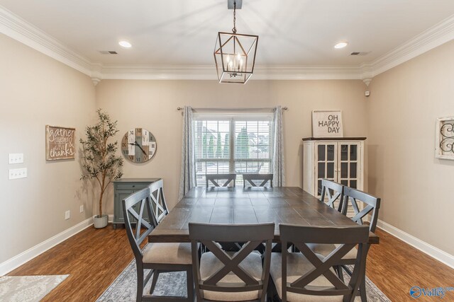 108 NW Rockhaven Dr, Madison, AL 35757 - dining space with wood finished floors, ornamental molding, baseboards, and recessed lighting