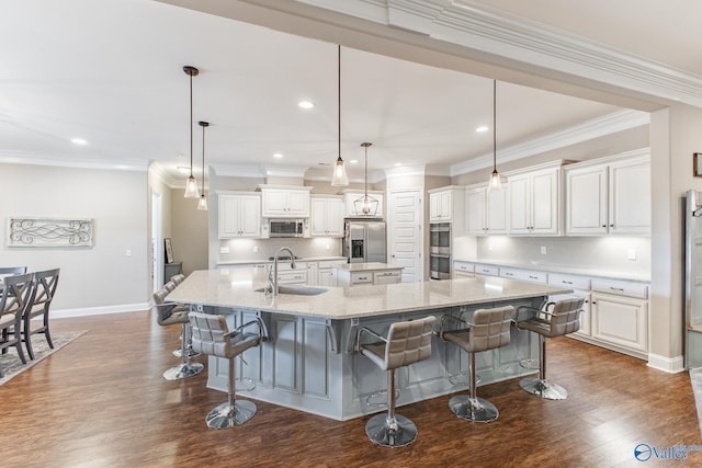 108 NW Rockhaven Dr, Madison, AL 35757 - kitchen with appliances with stainless steel finishes, a spacious island, tasteful backsplash, a sink, and dark wood-style floors