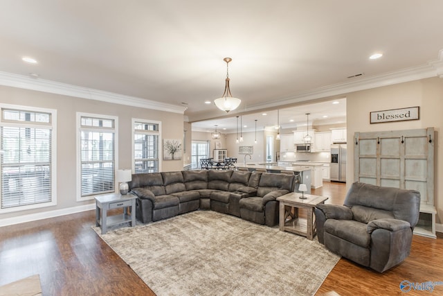 108 NW Rockhaven Dr, Madison, AL 35757 - living room with crown molding, wood finished floors, recessed lighting, and baseboards