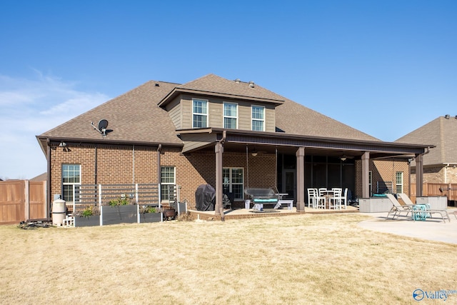 108 NW Rockhaven Dr, Madison, AL 35757 - back of house featuring brick siding, a patio, and a shingled roof