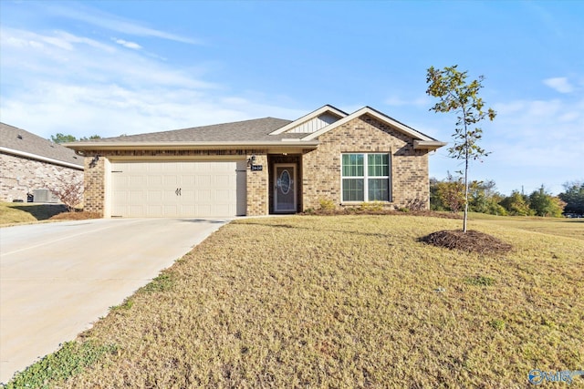 single story home featuring brick siding, a front yard, driveway, and a garage