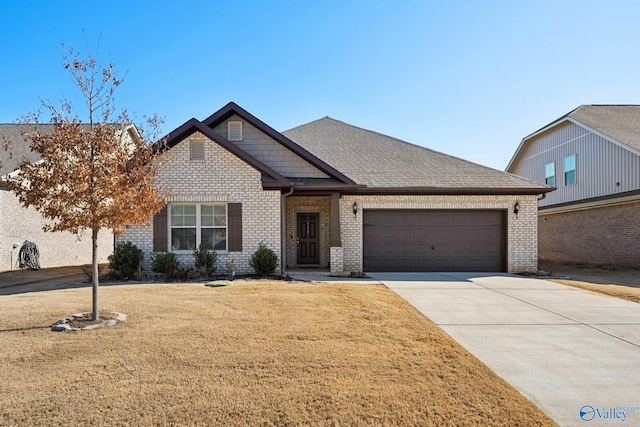 view of front of home featuring a garage and a front lawn