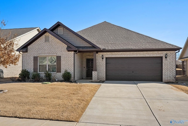 view of front of property featuring a garage and a front yard