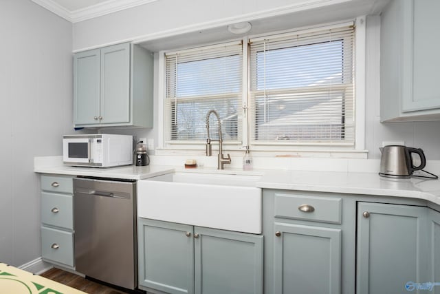 kitchen featuring stainless steel dishwasher, plenty of natural light, sink, and crown molding