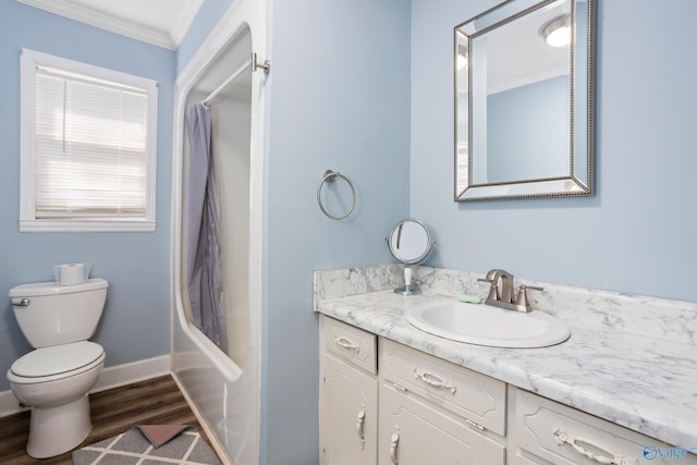 full bathroom featuring shower / bath combo, toilet, vanity, hardwood / wood-style floors, and crown molding