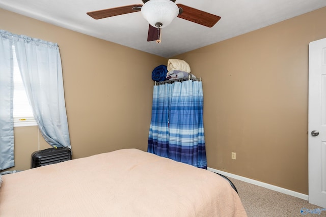 bedroom with ceiling fan and carpet flooring