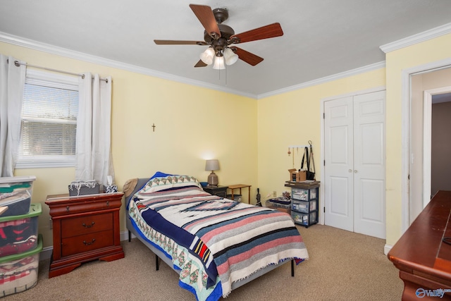 bedroom featuring light carpet, ceiling fan, a closet, and crown molding