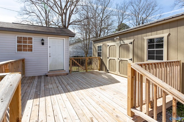 wooden deck featuring a shed