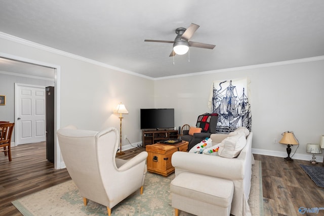 living room with ornamental molding, ceiling fan, and dark wood-type flooring