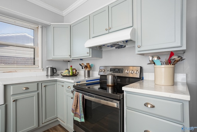 kitchen with ornamental molding, electric range, and gray cabinetry