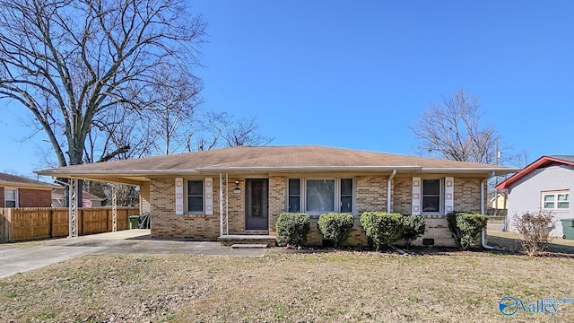 ranch-style home with a front yard and a carport