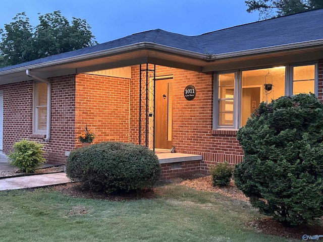 1011 Cole Dr SE, Huntsville, AL 35802 - doorway to property featuring brick siding and a lawn