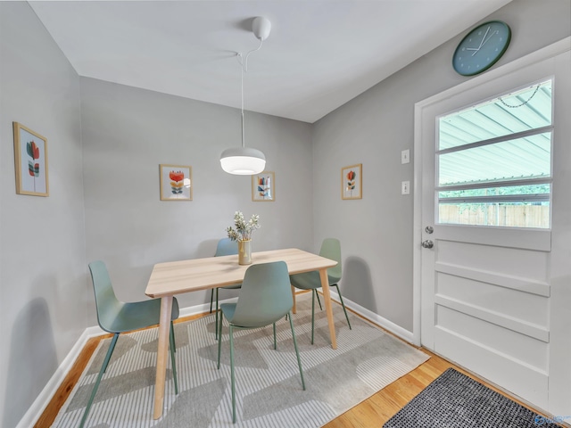 1011 Cole Dr SE, Huntsville, AL 35802 - dining area featuring light wood-style flooring and baseboards