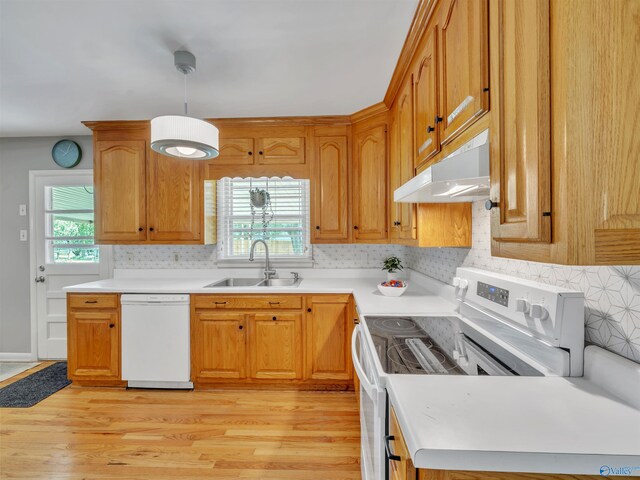 1011 Cole Dr SE, Huntsville, AL 35802 - kitchen with white appliances, under cabinet range hood, plenty of natural light, and light wood-style floors
