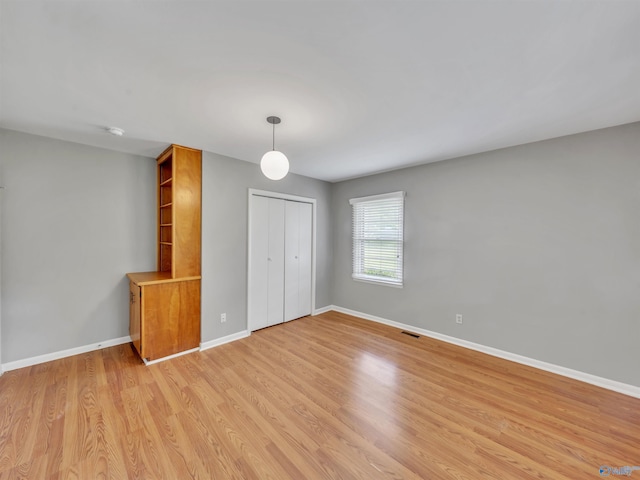 1011 Cole Dr SE, Huntsville, AL 35802 - unfurnished room with light wood-style flooring and a smoke detector