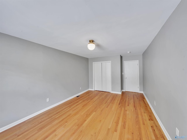 1011 Cole Dr SE, Huntsville, AL 35802 - unfurnished bedroom featuring a closet and light wood-style flooring