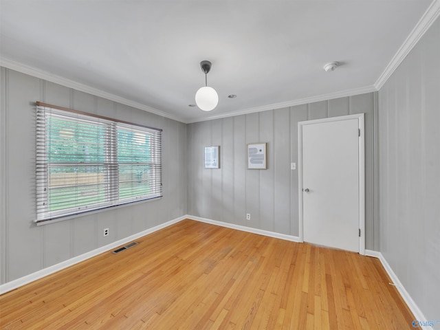 1011 Cole Dr SE, Huntsville, AL 35802 - unfurnished room with crown molding, a smoke detector, and light wood-type flooring