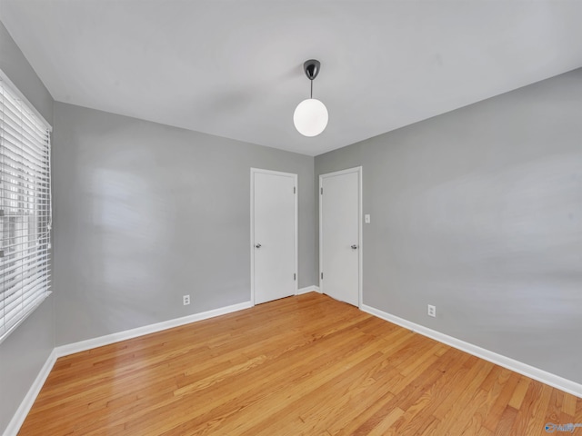 1011 Cole Dr SE, Huntsville, AL 35802 - unfurnished room featuring baseboards and light wood-style floors