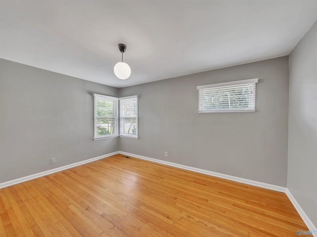 1011 Cole Dr SE, Huntsville, AL 35802 - spare room with baseboards and light wood finished floors
