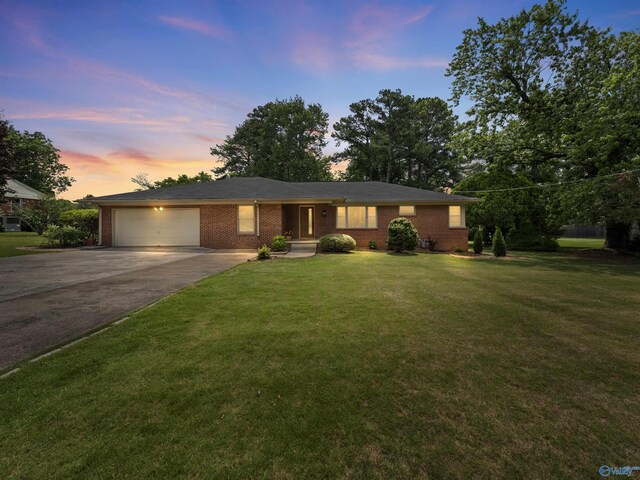 1011 Cole Dr SE, Huntsville, AL 35802 - single story home with a garage, concrete driveway, brick siding, and a lawn
