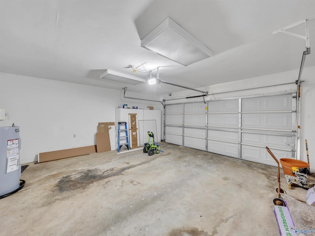 1011 Cole Dr SE, Huntsville, AL 35802 - garage with water heater and a garage door opener