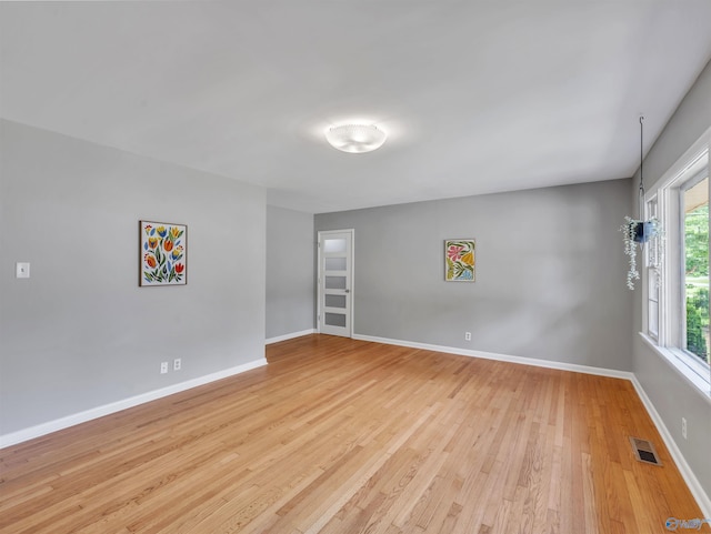 1011 Cole Dr SE, Huntsville, AL 35802 - spare room with light wood-type flooring and baseboards