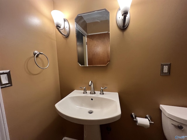half bathroom with toilet