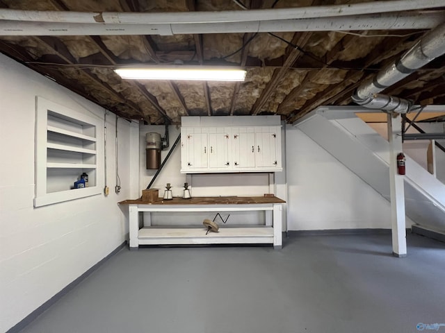 unfinished basement featuring baseboards