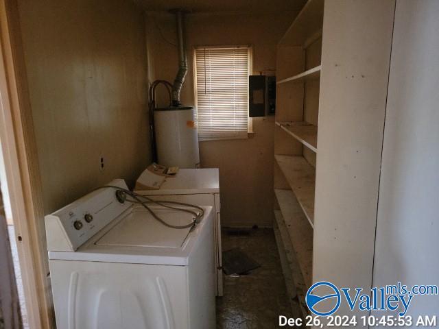 washroom with washer and clothes dryer and water heater