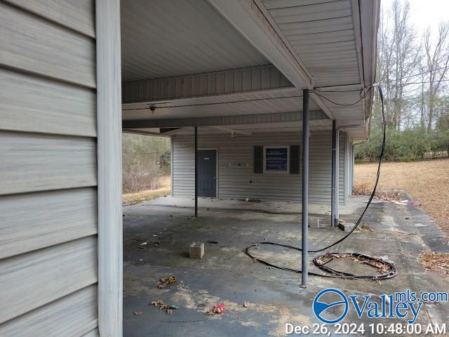 view of patio / terrace with a carport