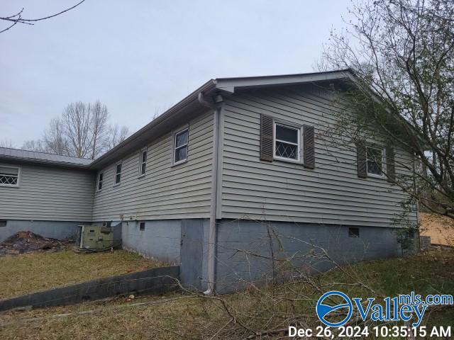 view of home's exterior featuring central AC unit