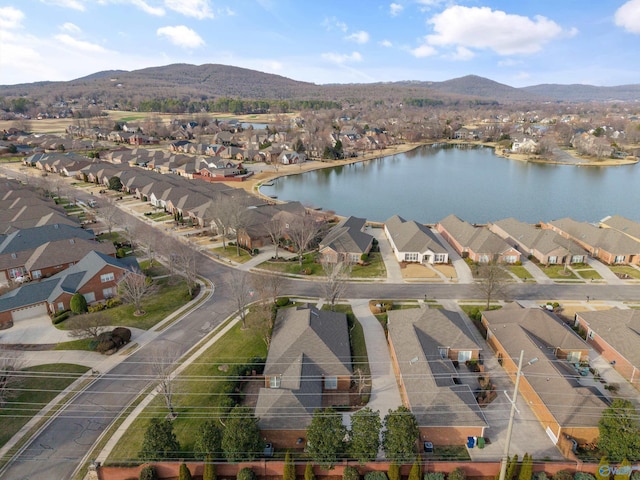 drone / aerial view featuring a water and mountain view