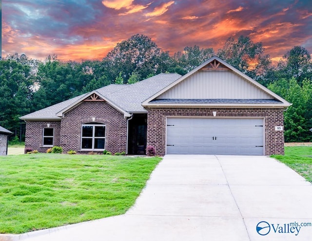 95 Hawthorn Way, Trinity, AL 35673 - view of front of house with brick siding, a garage, concrete driveway, and a lawn
