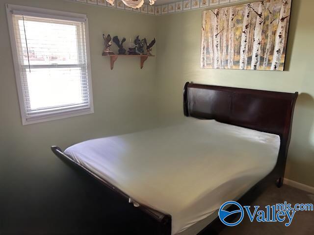 bedroom featuring baseboards