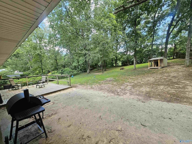 view of yard featuring a wooden deck