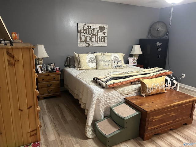 bedroom with hardwood / wood-style floors