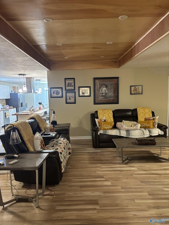 living room featuring wood-type flooring and wooden ceiling