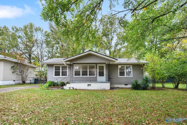 ranch-style home with a front yard