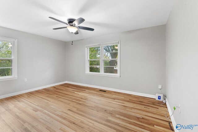 unfurnished room featuring ceiling fan and light hardwood / wood-style flooring