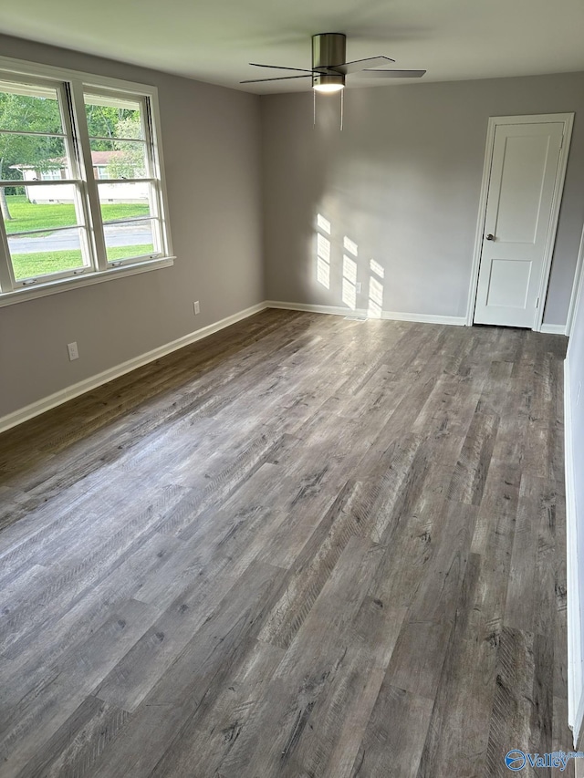 2022 Bide A Wee Dr NE, Huntsville, AL 35801 - empty room featuring ceiling fan, dark wood-type flooring, and baseboards